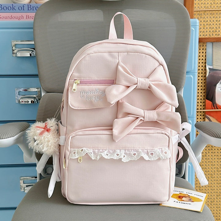 Søt ryggsekk med sløyfe dekorasjon til skolebruk