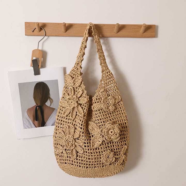 Crocheted shoulder bag with floral appliqués Skanto