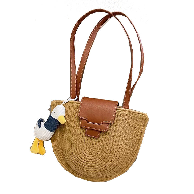 Modern tote bag made of woven material with playful pendant Skanto