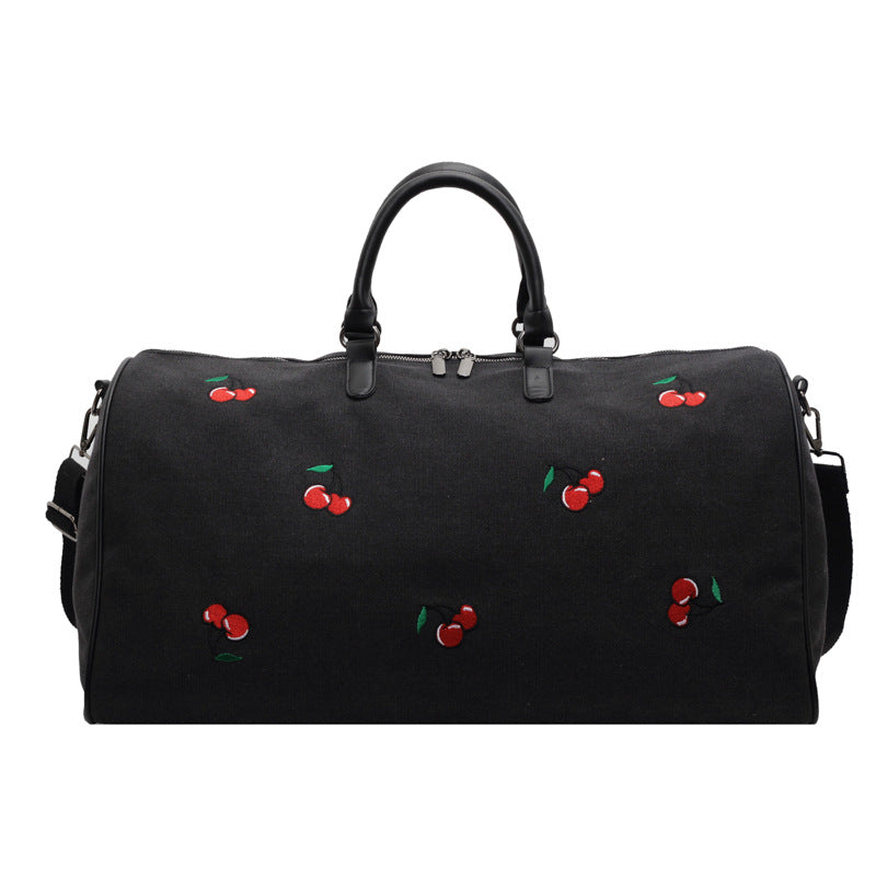 Sporty weekend bag with playful cherry pattern Skanto
