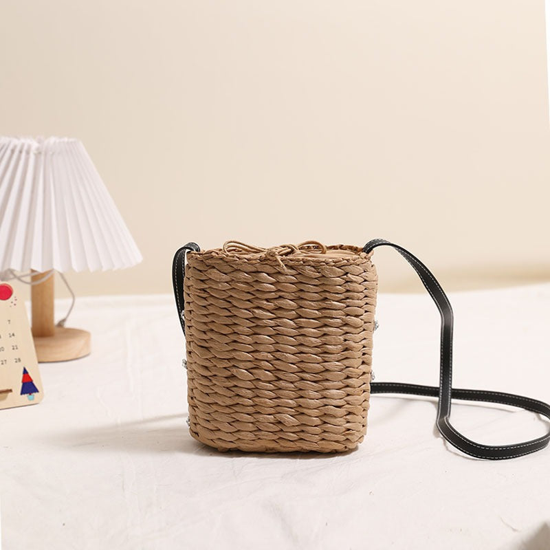 Woven natural material handbag with sparkling applications Skanto