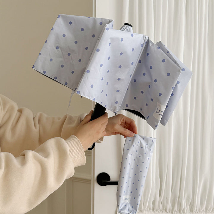DameFaltparaply med robust mekanisme og stillegant design Skanto
