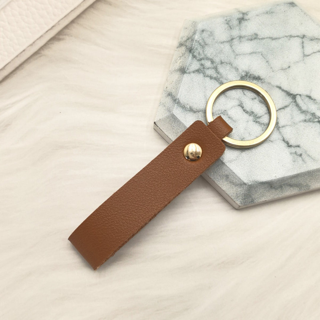 Unisex nøkkelring laget av høykvalitets kunstskinn med elegant metalldekor Skanto