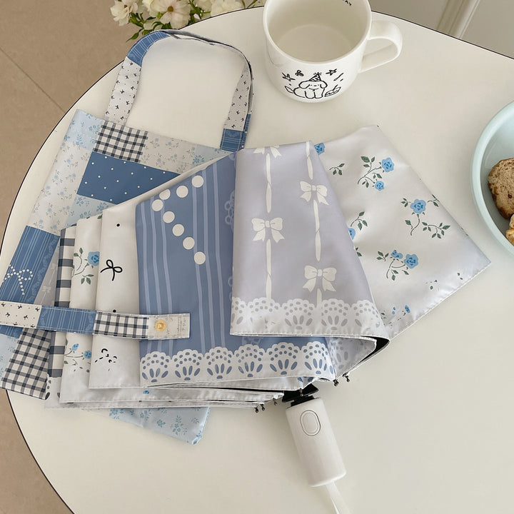 Damer paraply i romantisk patchwork-design Skanto
