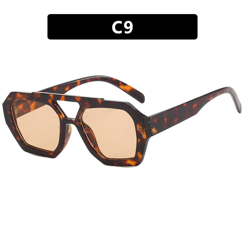 Dame oversized solbrille i markant, åttkantet design Skanto