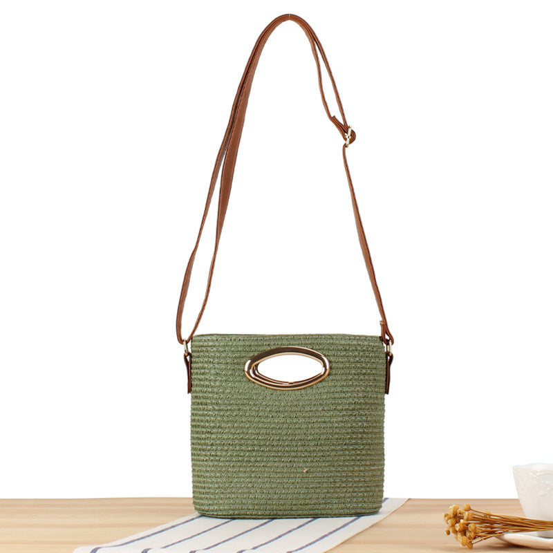 Handwoven natural material crossbody bag with elegant ring clasp Skanto