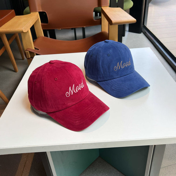 Kvinnenes broderte statement caps Skanto