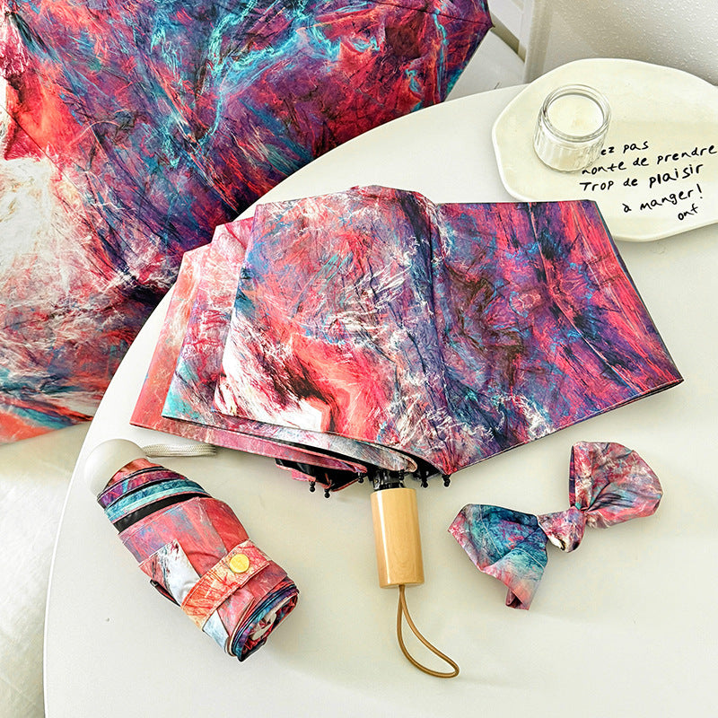 Dame sammenleggbart paraply med kreativt kunstdesign Skanto
