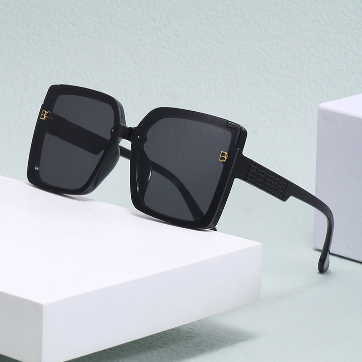 Dame fashionable square solbriller med strukturert bøyledesign Skanto