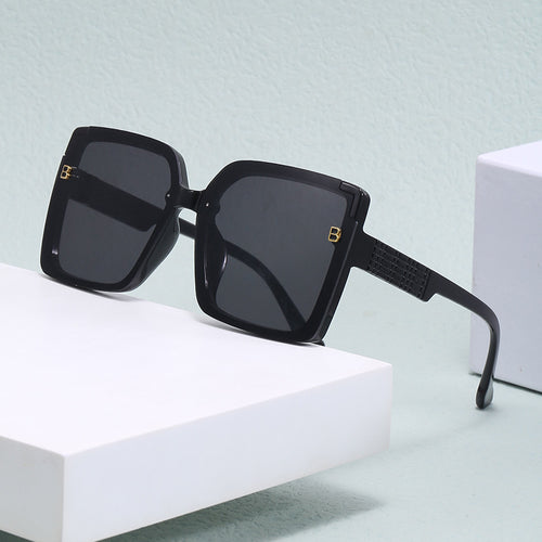 Dame fashionable square solbriller med strukturert bøyledesign Skanto