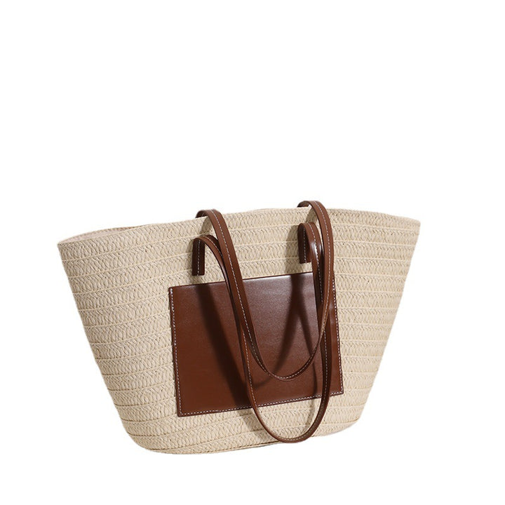 Elegant straw bag with stylish leather details Skanto