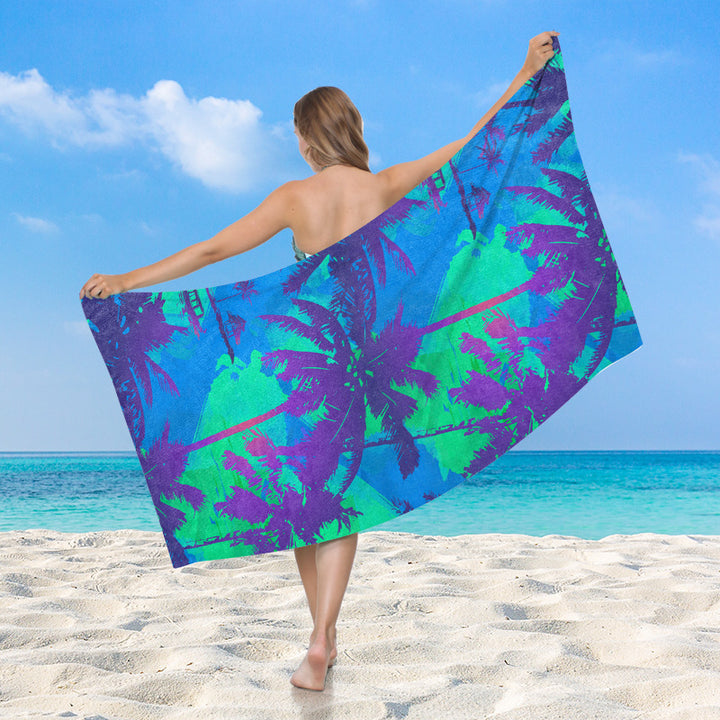 Women's beach towel with vibrant palm motif Skanto