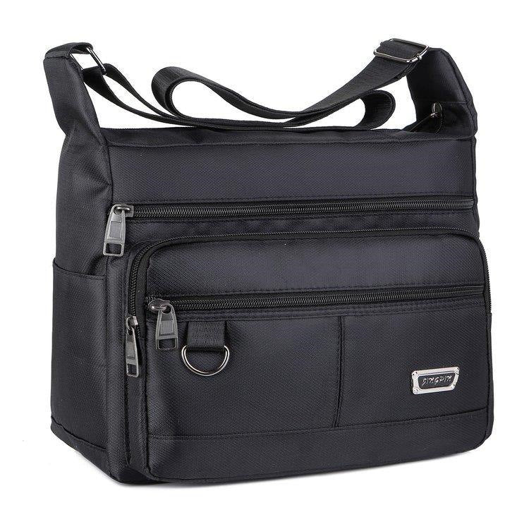 Praktisk crossbody-veske med multifunksjonelt fagssystem Skanto