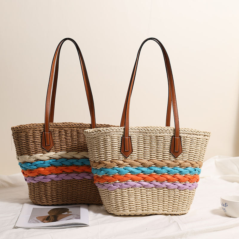 Basket-style straw bag with colorful braided accents Skanto
