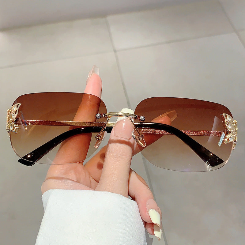 Women's fashionable sunglasses with filigree butterfly design and protective lenses Skanto