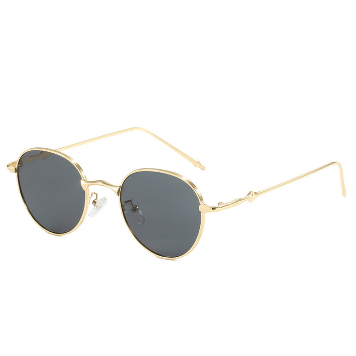 Dame elegante runde solbriller med moderne metallramme Skanto