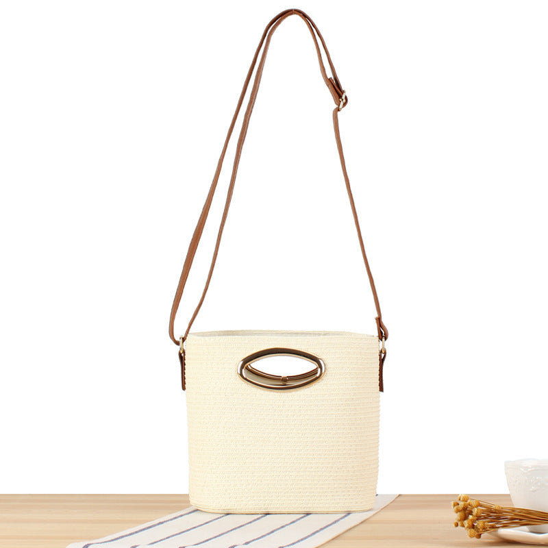 Handwoven natural material crossbody bag with elegant ring clasp Skanto