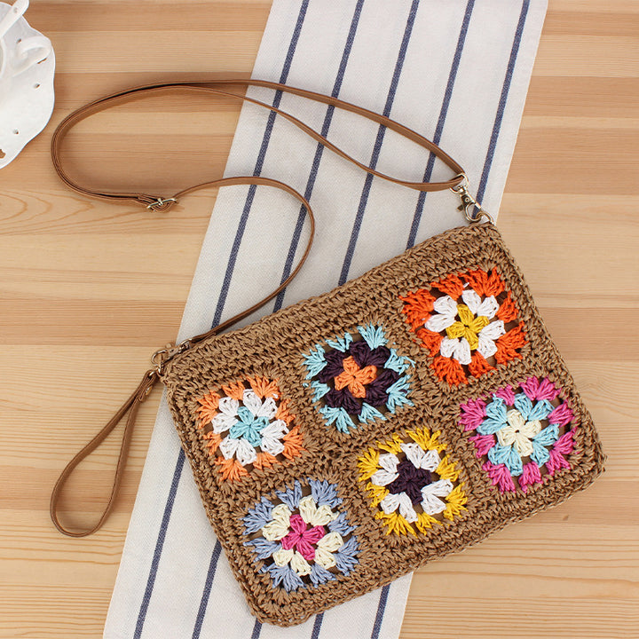 Hand-knotted shoulder bag with colorful floral design Skanto
