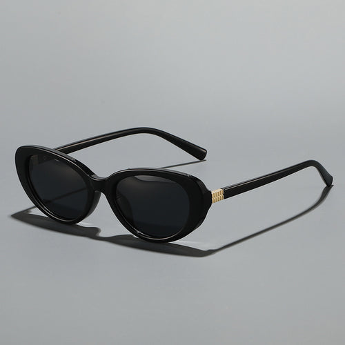 Damer moter solbrille i elegant Cat-Eye-stil Skanto