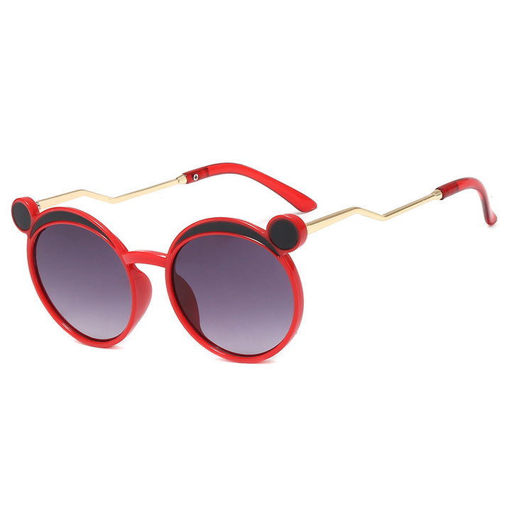 Dame Fashion-runde solbrille med innovativ ramme og fargede linser Skanto