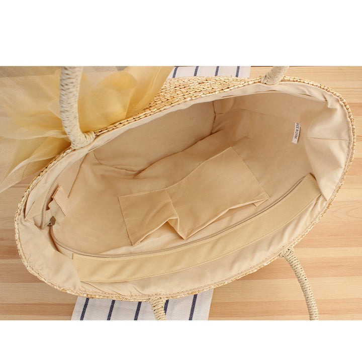 Elegant straw bag with floral accents Skanto