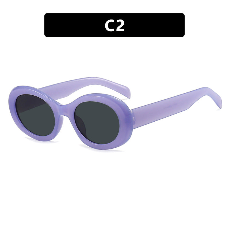 Women's fashionable sunglasses in original oval design with transparent frame and UV protection Skanto