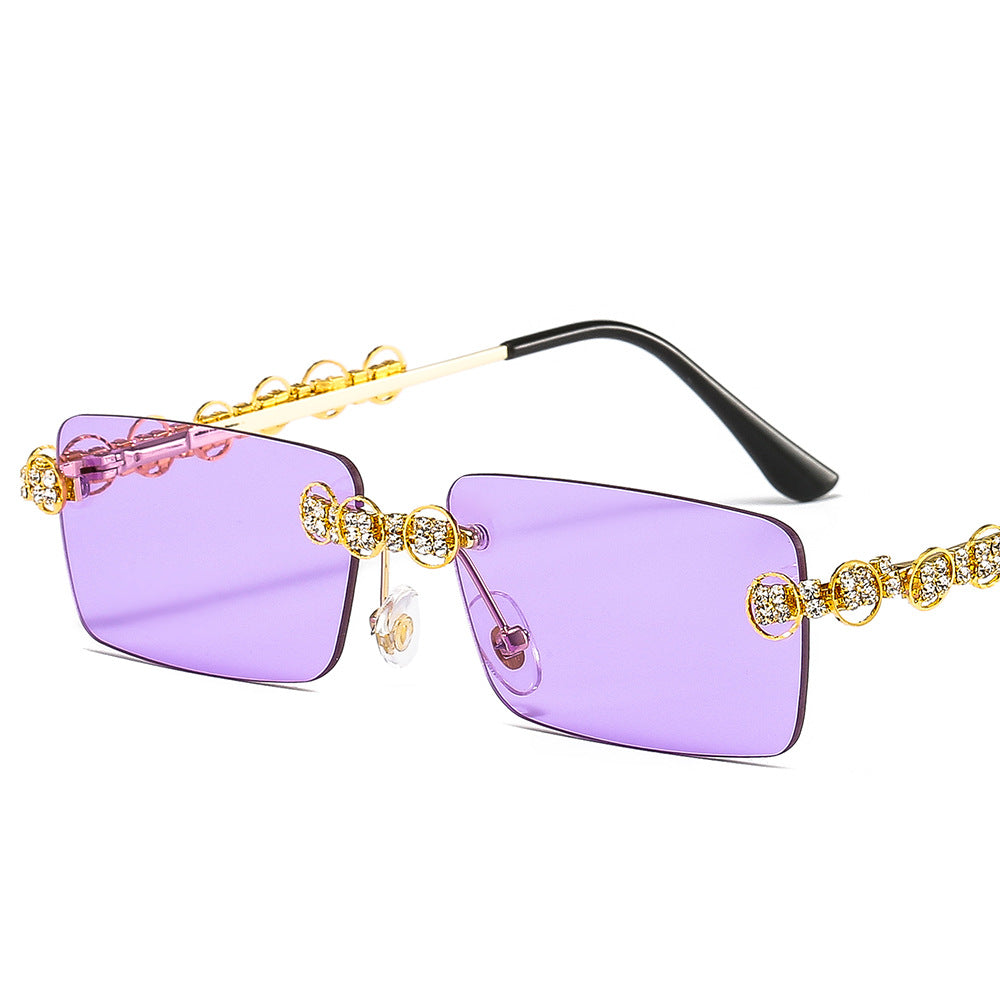 Dame Designer-solbrille med glitrende ramme og rektangulært glass Skanto