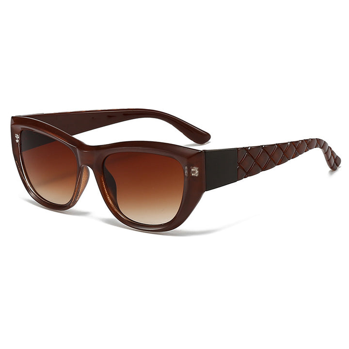 Dame Cat-Eye solbrille med elegant, transparent ramme Skanto