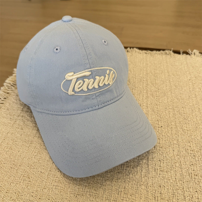 Herresportcaps med tennisgrafikk Skanto