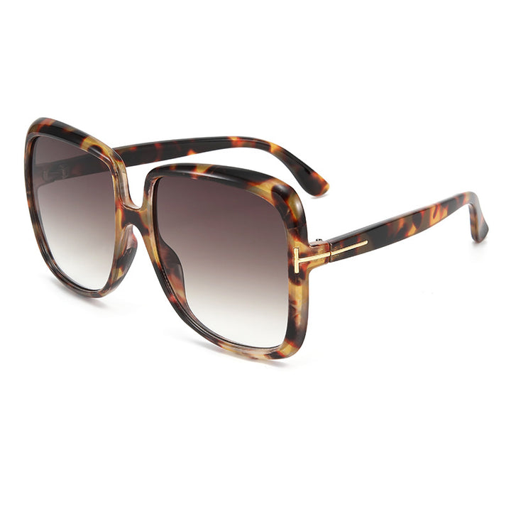 Dame elegant oversized solbrille med filigranramme Skanto