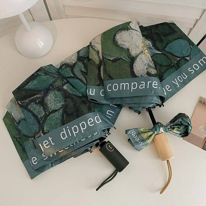 Damer sammenleggbart paraply med florale accenter Skanto
