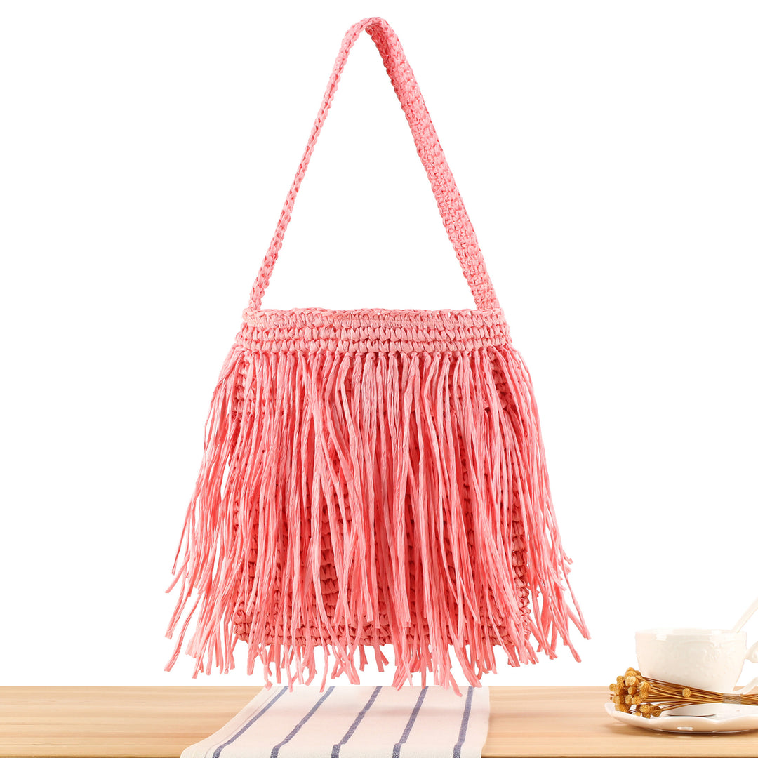 Trendy straw bag with fringed design Skanto
