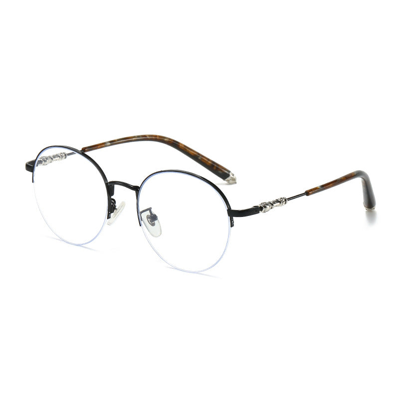 Dame rund solbrille med elegant metallramme og komfortable nesepads Skanto