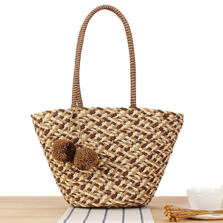 Modern basket bag with decorative pom poms Skanto