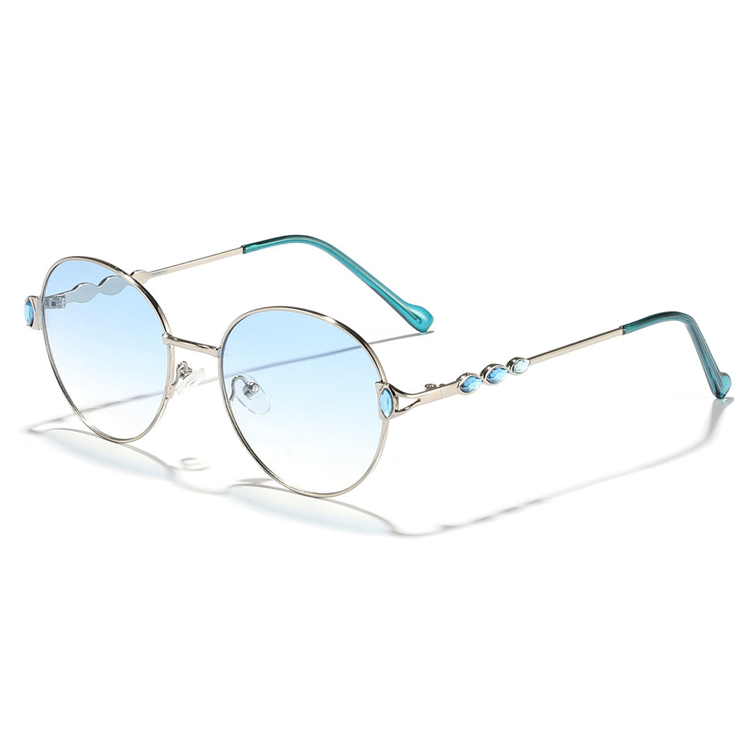 Dame rund solbrille med elegant metallramme og speilvendte glass Skanto