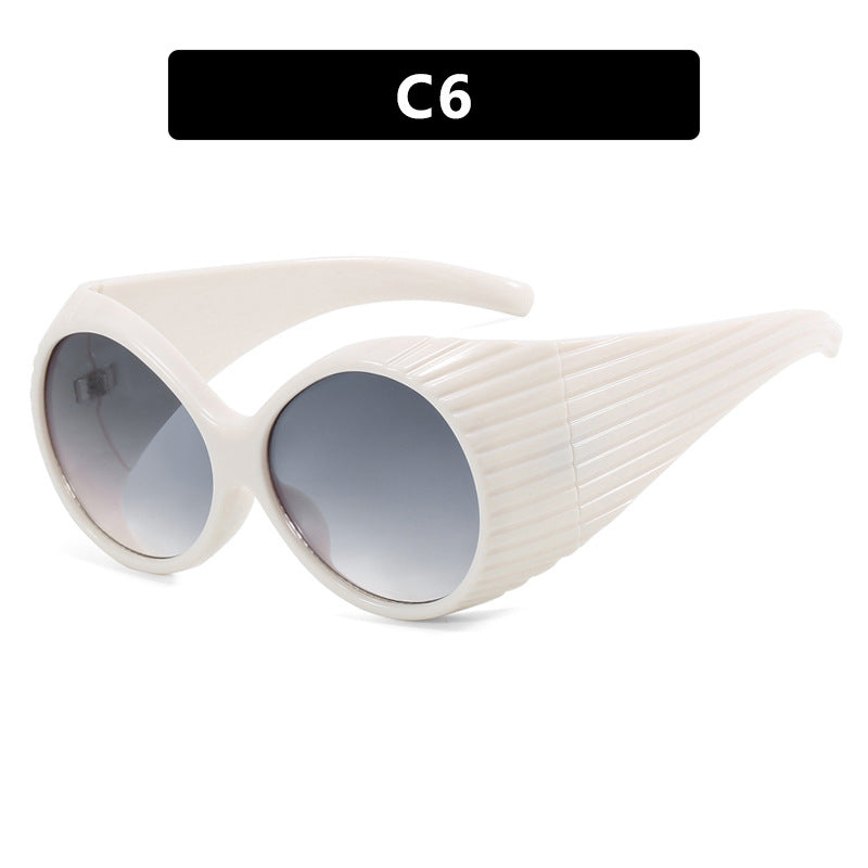 Women's extravagant sunglasses with curved frame Skanto