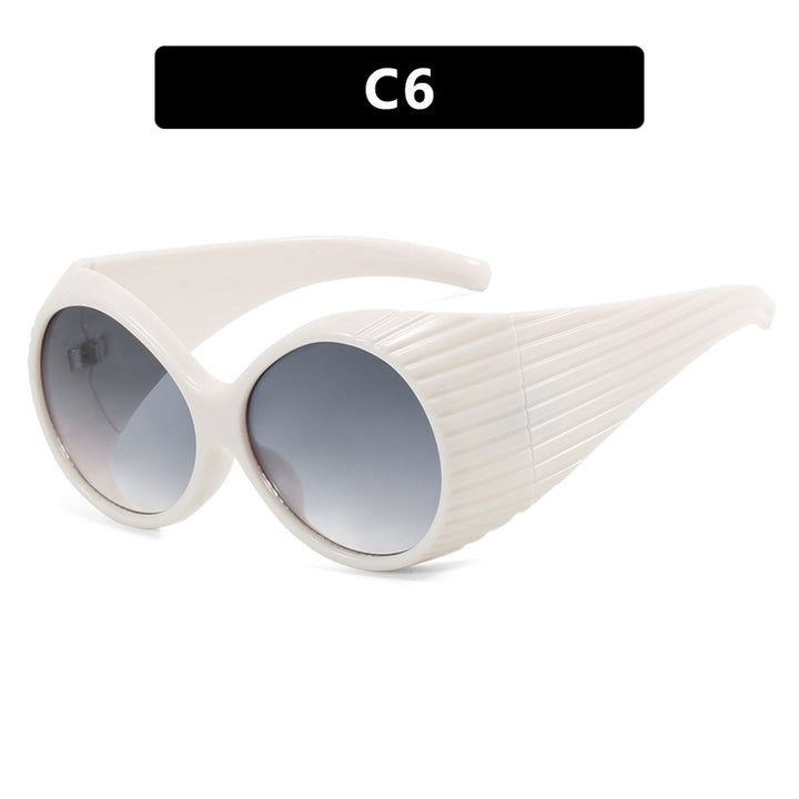 Women's extravagant sunglasses with curved frame Skanto