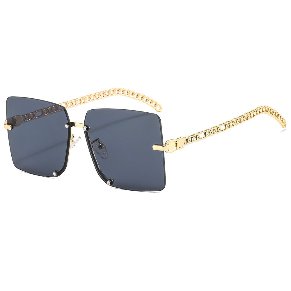Dame moter solbriller med luksuriøs kjedearm og rektangulær ramme Skanto