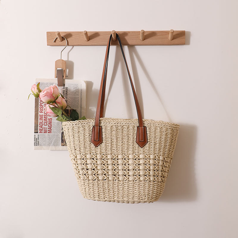 Handmade rattan basket bag with elegant leather details Skanto