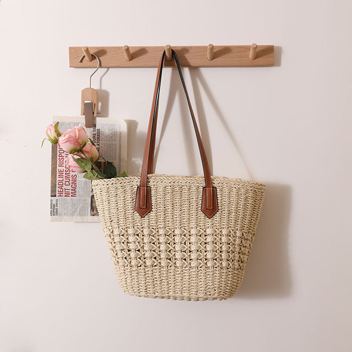 Handmade rattan basket bag with elegant leather details Skanto