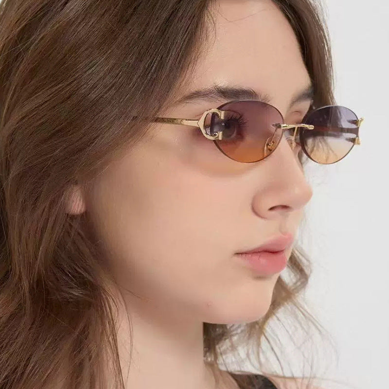 Women's elegant oval sunglasses with modern metal frame Skanto
