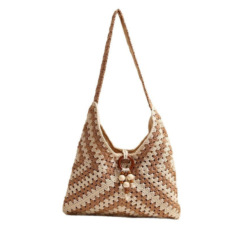 Handmade macrame shoulder bag with playful pendant Skanto