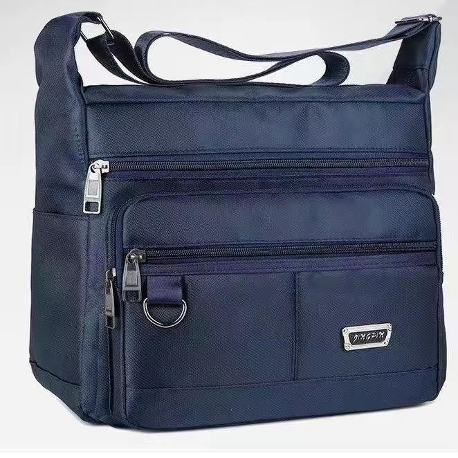 Praktisk crossbody-veske med multifunksjonelt fagssystem Skanto