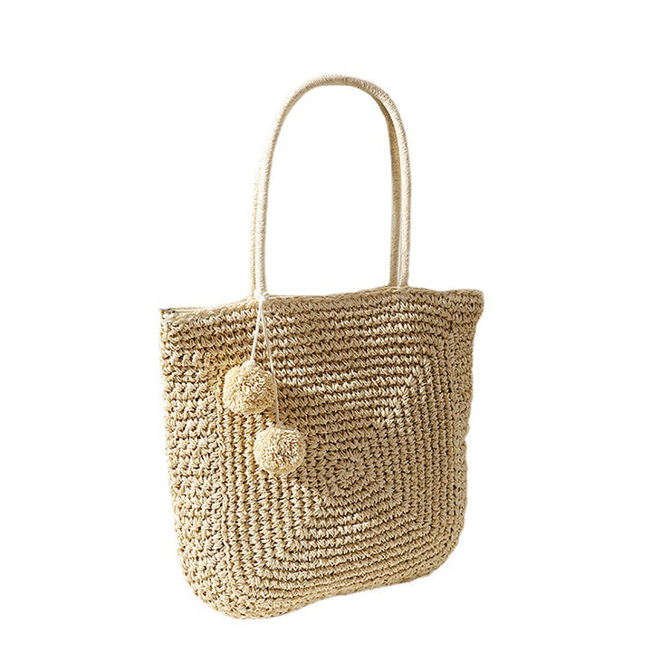 Handmade straw bag with pompom details Skanto