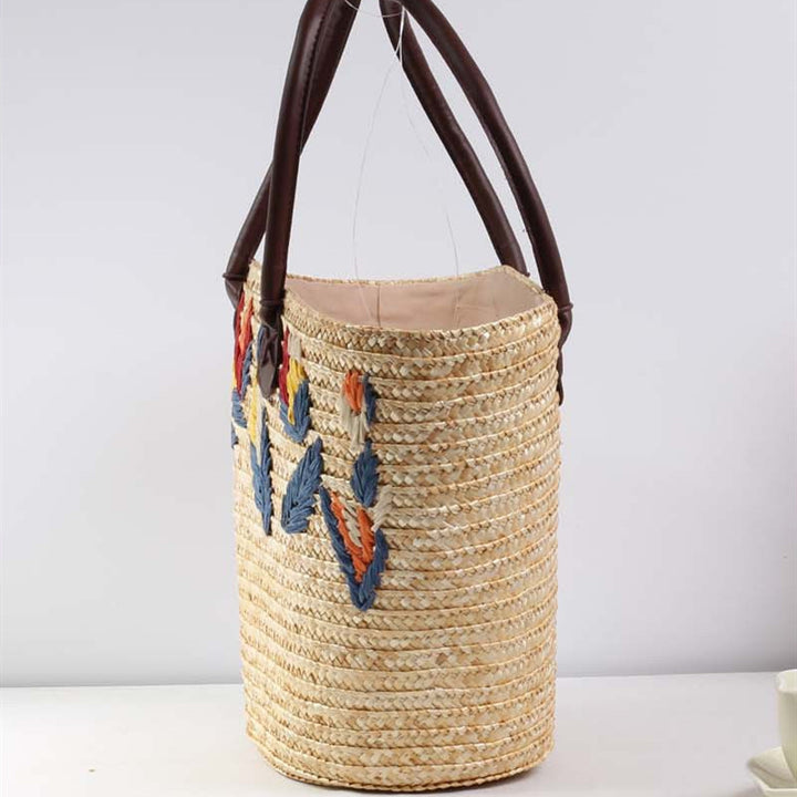 Braided beach bag with colorful embroidery pattern Skanto