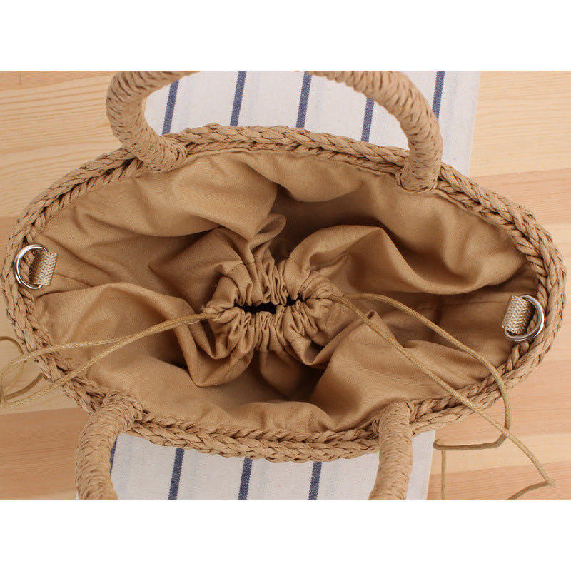 Handbag made of woven natural material with fashionable fringes Skanto