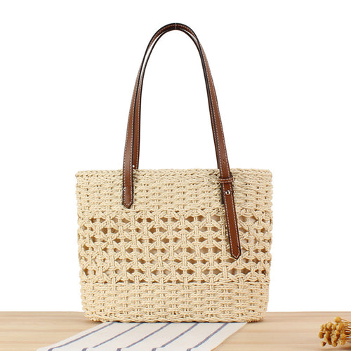 Handbag made of hand-woven straw with elegant faux leather handles Skanto