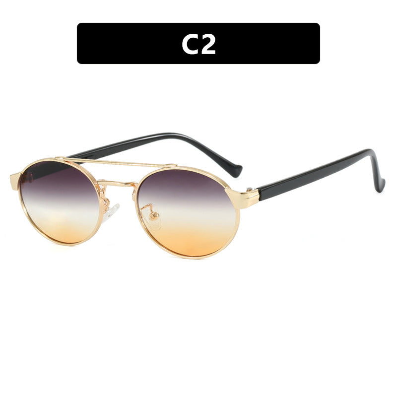 Women's fashionable sunglasses in stylish round design with gold accents Skanto