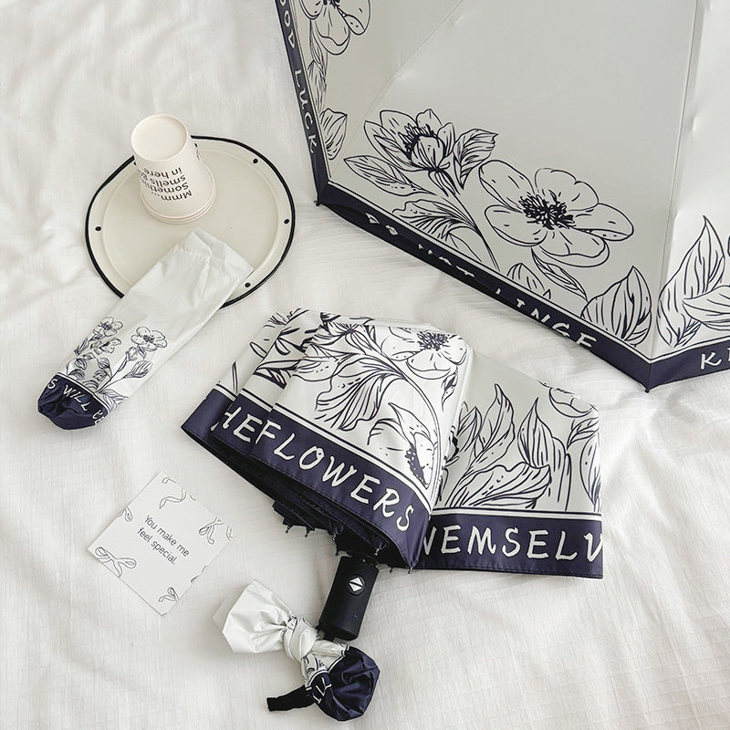 Dame sammenleggbart paraply med kreativt kunstdesign Skanto