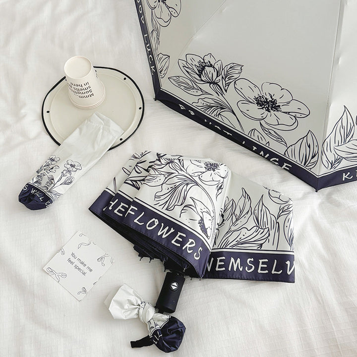 Dame sammenleggbart paraply med kreativt kunstdesign Skanto